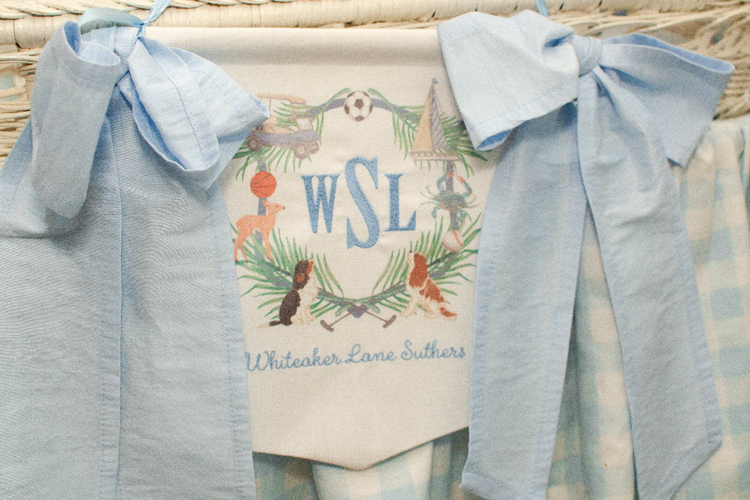 Banner for boy with embroidered monogram and blue bows