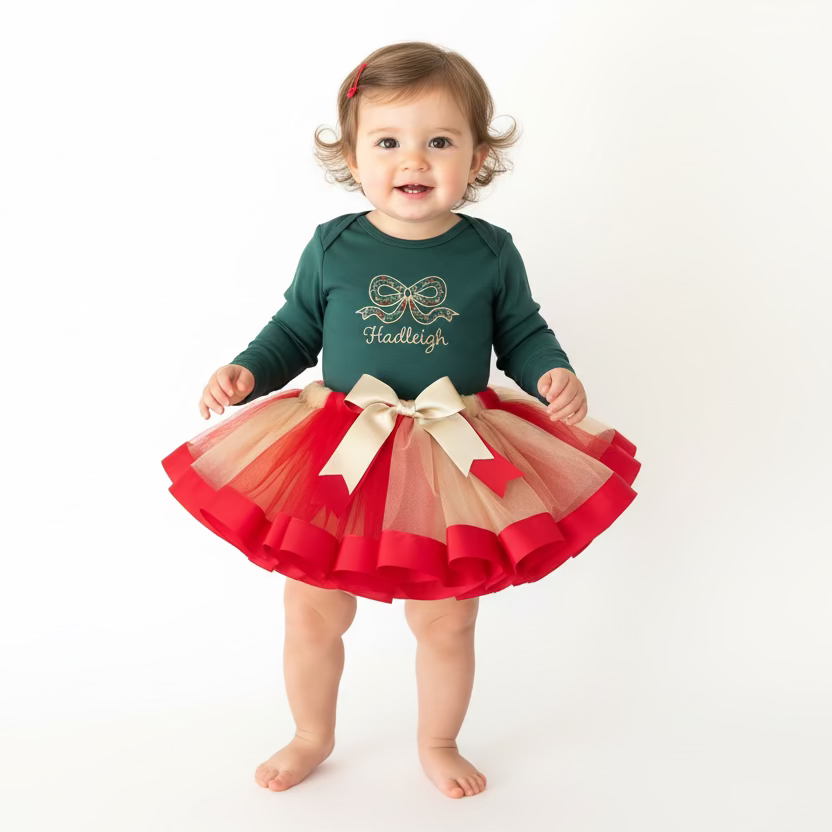 Children's outfit with green top and red and beige skirt on a mannequin against a white background