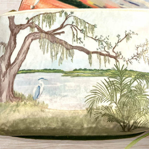 Velvet Pouch with Isle of Hope Marsh in Savannah watercolor featuring a tree, lake, and blue heron.
